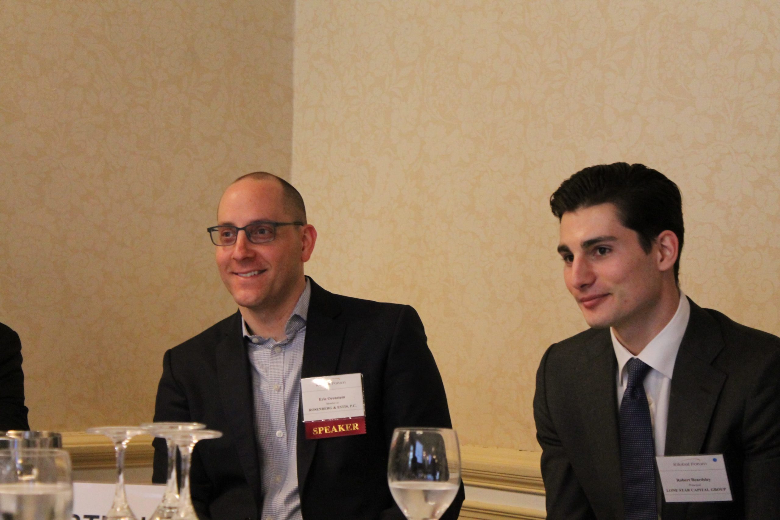 Photo of  Eric S. Orenstein with a panelist