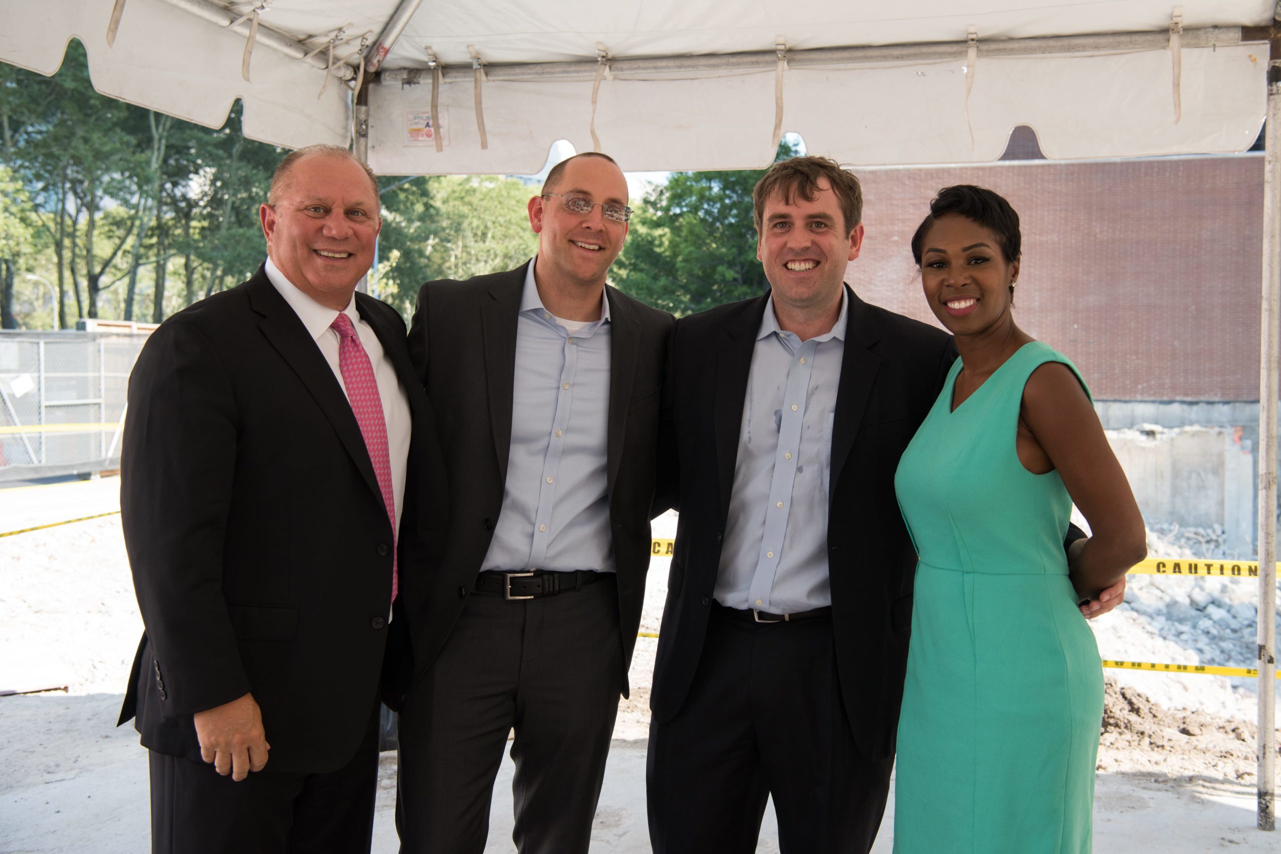 Photo of R&E attorneys Eric S. Orenstein & John B. Acierno along with client and the developer at the One Clinton ground